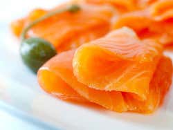 A plate of orange smoked salmon